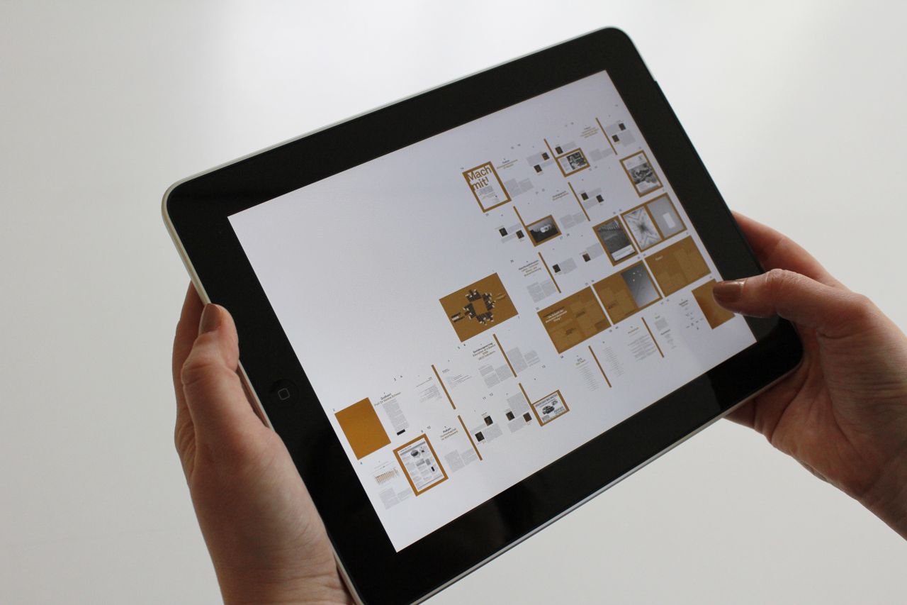 why-choose-us Close-up of hands using a tablet, displaying a digital interface.